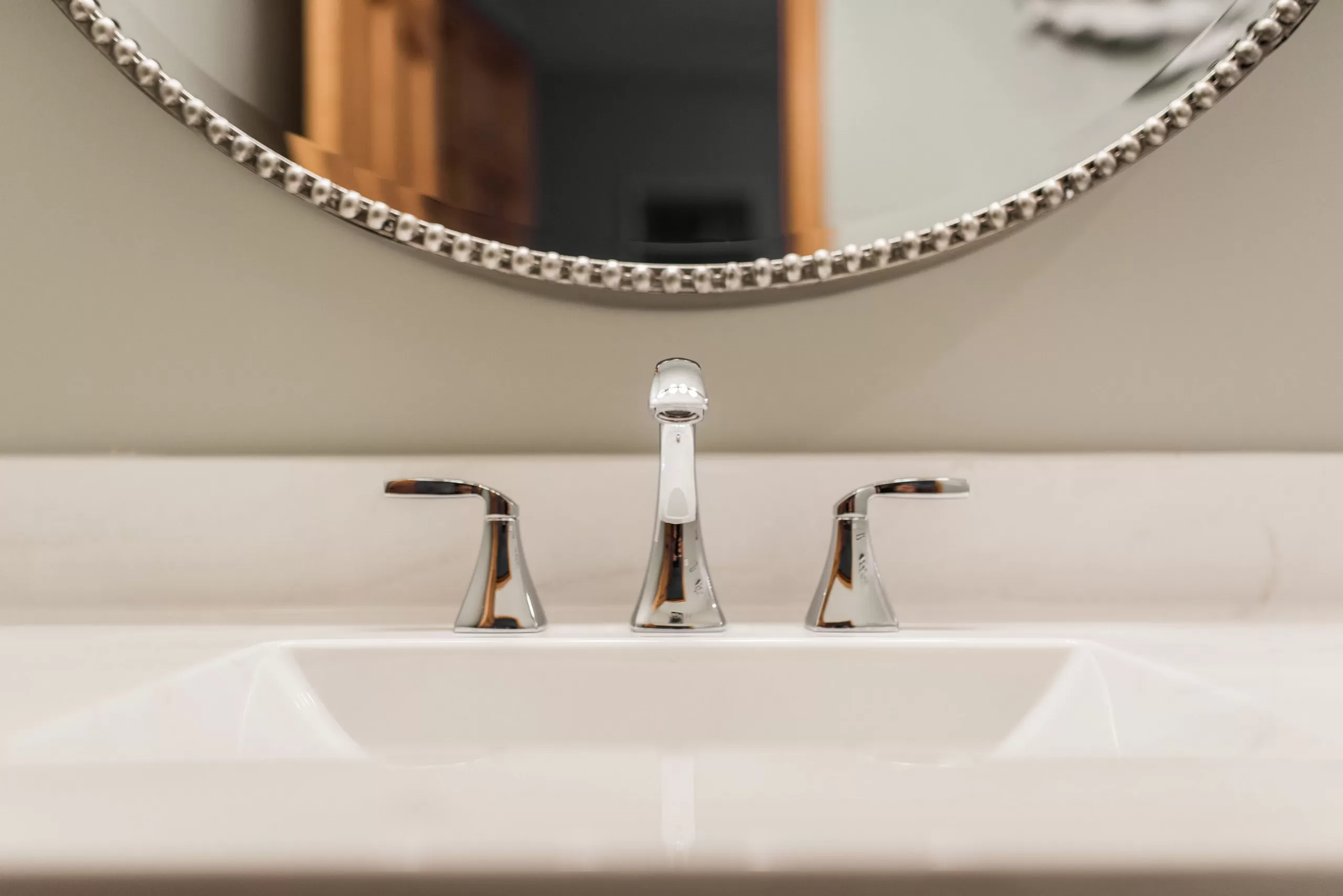 close up of faucet and sink in bathroom remodel