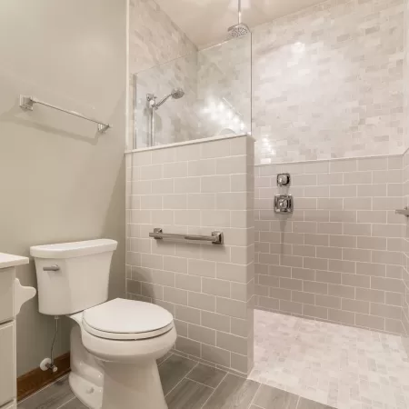 bathroom remodel with overwrap sink and modern faucets