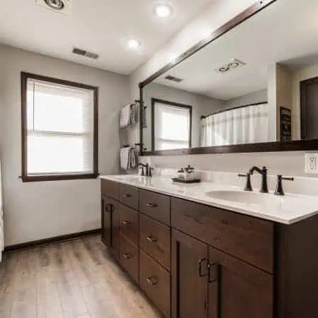 Brown bathroom remodel in Steward IL cherrywood cabinets