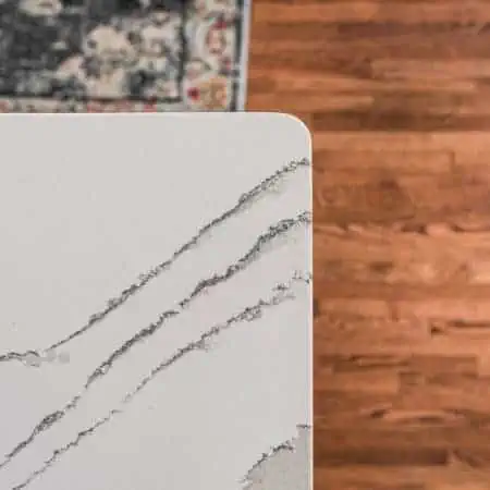 White kitchen remodel with marble kitchen counters