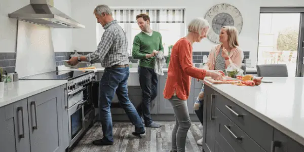 family cooking in remodeled kitchen
