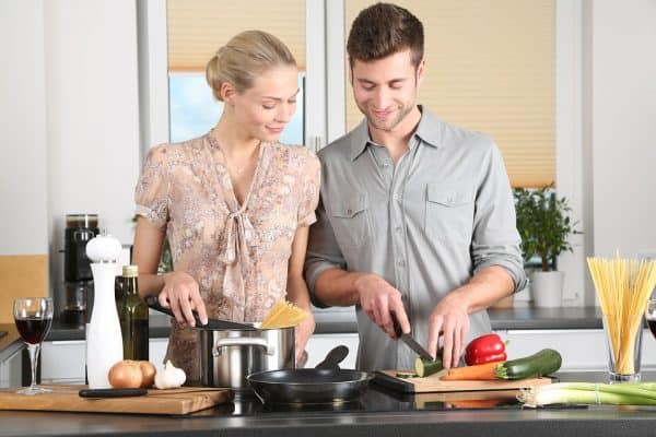 couple cooking in remodeled kitchen