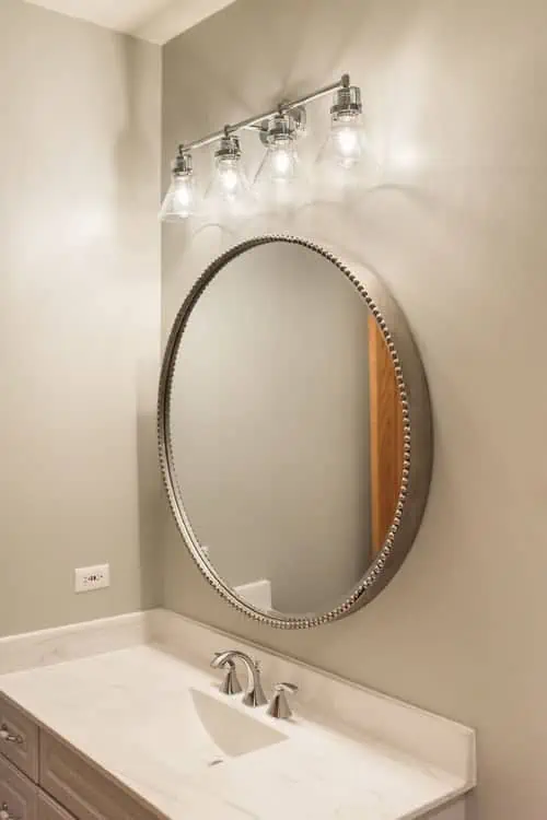 large mirror with bathroom remodel
