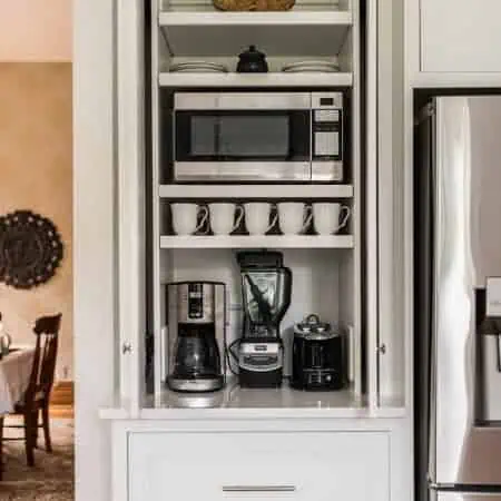 custom white cabinet in white kitchen