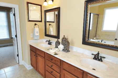 traditional marble bathroom remodel with yellow paint