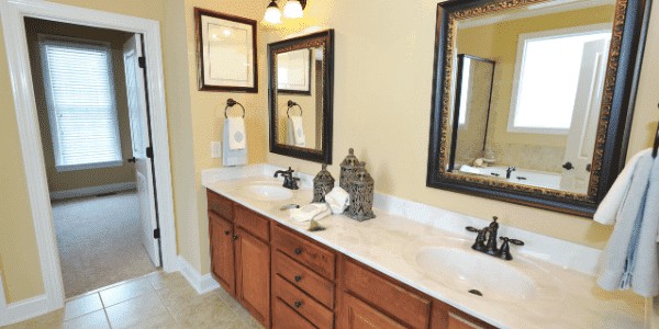 traditional marble bathroom remodel with yellow paint