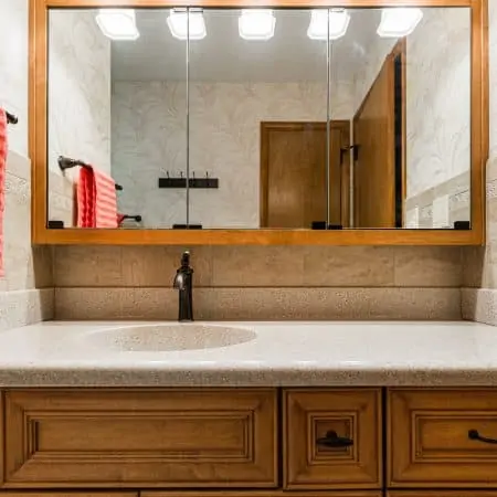 bathroom remodel with wood cabinets