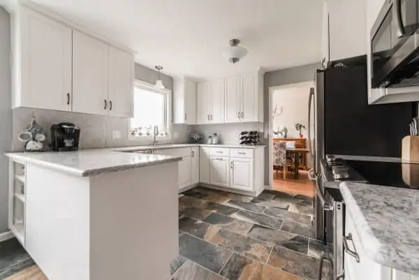 kitchen remodel stone floor white cabinets