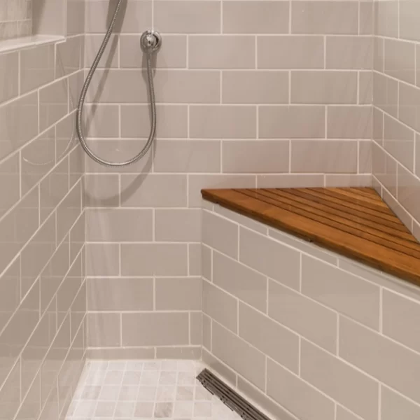 Barrier Free Bathroom with grab bars, seat and shower extender